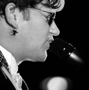Marco Wishaw as Elton John